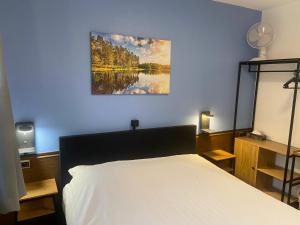 Postel nebo postele na pokoji v ubytování Hotel Monika