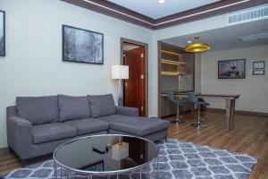 a living room with a couch and a table at Savan Resorts in Savannakhet