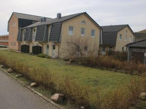 a row of houses on the side of a road at Holiday home Lilly in Staberdorf