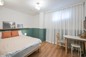 Postel nebo postele na pokoji v ubytování SSH Myeongdong Dongdo Hostel