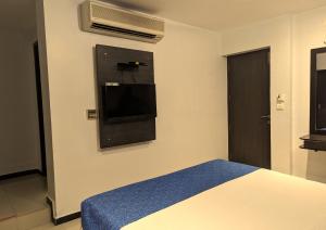 Postel nebo postele na pokoji v ubytování RBS Residency