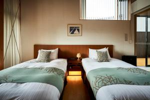 Letto o letti in una camera di Sanso Amanosato