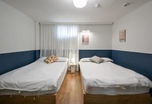 Postel nebo postele na pokoji v ubytování SSH Myeongdong Dongdo Hostel