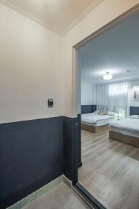 Postel nebo postele na pokoji v ubytování SSH Myeongdong Dongdo Hostel