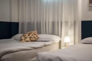 Postel nebo postele na pokoji v ubytování SSH Myeongdong Dongdo Hostel
