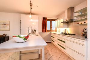 a kitchen with a sink and a bowl on a counter at Villa Erika in Manerba del Garda