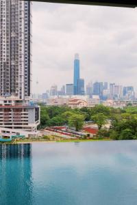 a large body of water in front of a city at Muji Home Lavile KL Sunway Velocity 双威永乐城中文房东Pool in Kuala Lumpur