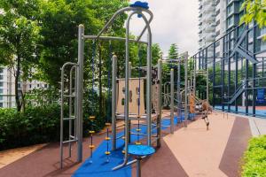 a row of play equipment in a playground at Muji Home Lavile KL Sunway Velocity 双威永乐城中文房东Pool in Kuala Lumpur