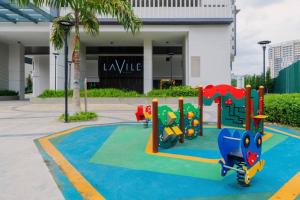 a playground in front of a building at Muji Home Lavile KL Sunway Velocity 双威永乐城中文房东Pool in Kuala Lumpur