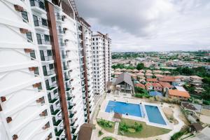 an aerial view of a apartment building with a swimming pool at Royal Oceancrest Mactan Condominium Unit 1418 in Sudtungan