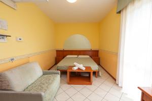 Postel nebo postele na pokoji v ubytování Hotel Roma Sul Mare + 27 fotografií