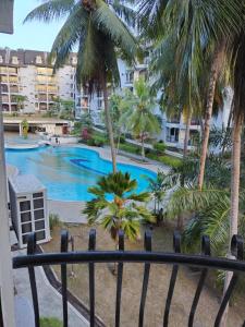 a view from the balcony of a resort with a swimming pool at CAMELIA HOLIDAY APARTMENT in Kuah