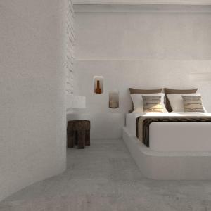 1 dormitorio blanco con 2 camas y mesa en Fos Collection Villas & Residences, en Platis Yialos Sifnos