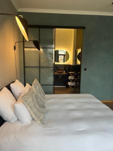 Postel nebo postele na pokoji v ubytování Boutique Hotel Marie Marie