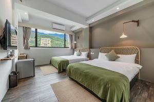 Postel nebo postele na pokoji v ubytování Kuma B&B