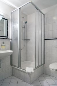 a bathroom with a shower and a sink at Gästehaus Moser in Weil am Rhein