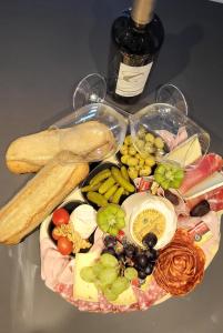 a plate of food with different types of food on a table at L'antre deux Pierres, suite de charme, romantisme, jacuzzi privé, braséro in Bouyon