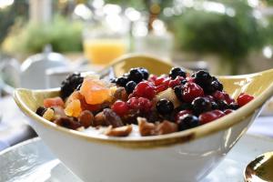 a bowl filled with fruit on top of a table at Heritage Villa Nobile in Dubrovnik