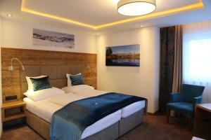 Postel nebo postele na pokoji v ubytování Hotel Vogt