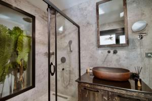 a bathroom with a wooden sink and a shower at Beach 222 Oludeniz in Oludeniz