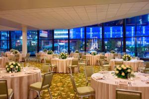 a banquet hall with tables and chairs with white linens at The Westin Cincinnati in Cincinnati