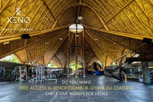 a large building with a large wooden ceiling at Rascals Hotel - Adults Only in Kuta Lombok