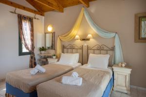 Ένα ή περισσότερα κρεβάτια σε δωμάτιο στο Irida Aparthotel Malia by Estia +29 φωτογραφίες