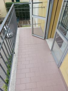 an open door of a building with a walkway at Deluxe Appartament near Racetrack 110 mq 4-5 People in Imola