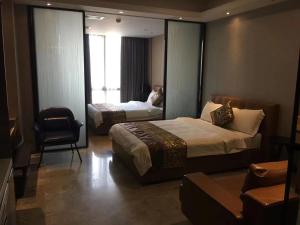Letto o letti in una camera di Yoyo Apartment Jiedeng Metropolis Branch, Beijing Road