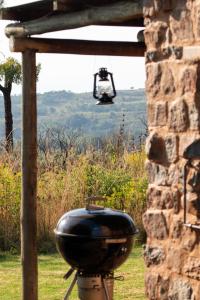 a grill sitting on top of a stone wall at Woolly Bugger Farm in Tonteldoos