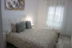 Postel nebo postele na pokoji v ubytování Apartamento Playa Velilla Park II