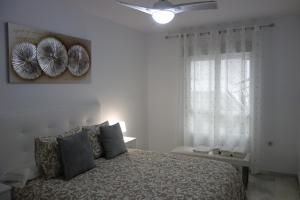 Postel nebo postele na pokoji v ubytování Apartamento Playa Velilla Park II