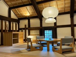 a dining room with a table and chairs at NIPPONIA Sawara Merchant Town Hotel in Katori