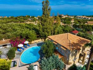 an aerial view of a villa with a swimming pool at Villa Archontiko in Makris Gialos