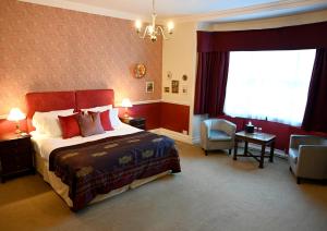 a hotel room with a bed and a window at Orchard Club - Newton House in Knaresborough