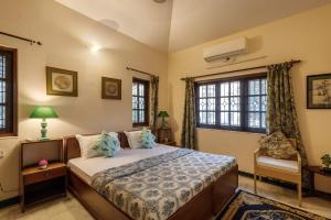 En eller flere senge i et værelse på Palm Oasis Residences By JadeCaps Whitefield AC