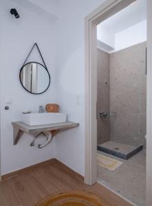 a bathroom with a sink and a shower at Villa Helia by Smaris Collection in MALIA in Kartsindanós