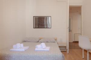 Giường trong phòng chung tại Palladio due - spazioso 3 camere