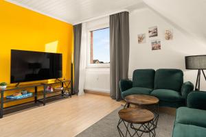 Μια τηλεόραση ή/και κέντρο ψυχαγωγίας στο Immo-Vision - Natur Design Apartments, Parkplatz, Küche