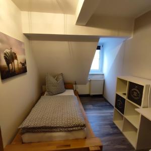 Postel nebo postele na pokoji v ubytování Ferienwohnung am Markt in Olbernhau