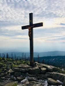 a wooden cross on top of a mountain at Quellenhof Kollnburg in Kollnburg