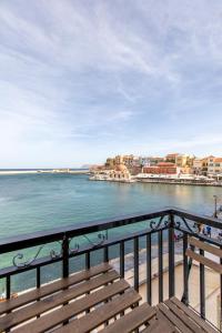 a view of the ocean from a balcony at Lucia Hotel in Chania