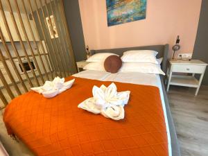 Posteľ alebo postele v izbe v ubytovaní DN Rose Apartmant