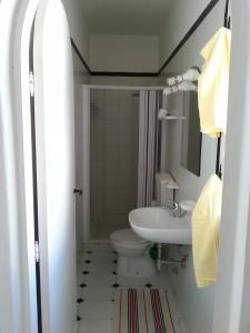 a bathroom with a toilet and a sink at Villa Jeko in Lampedusa