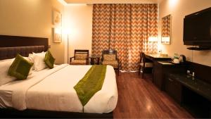 Postel nebo postele na pokoji v ubytování Amber Inn by Orion Hotels