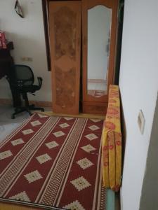 a room with a door and a rug on the floor at Mr. Hợp in Kim Côn