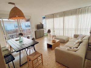 a living room with a couch and a table at Maison Dya Altea in Altea +30 photos