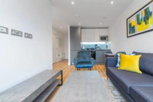 a living room with a couch and a table at Contemporary Studio in Central East Grinstead in East Grinstead