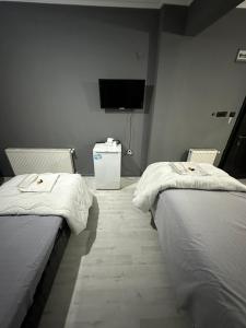 Cama o camas de una habitación en REYNA OTEL