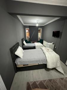 Ένα ή περισσότερα κρεβάτια σε δωμάτιο στο REYNA OTEL